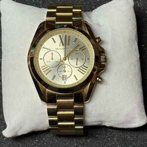 Michael Kors gold oversized watch.